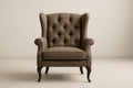 Brown fabric armchair with solid wood frame and cushions