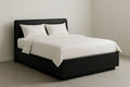 Platform bed 140x200x100 cm in black synthetic leather