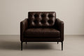 Brown leather armchair with steel legs